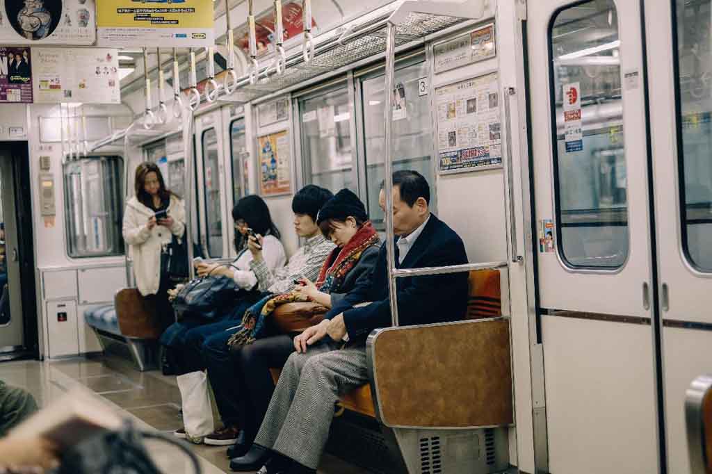 japanese people riding on train for transportation