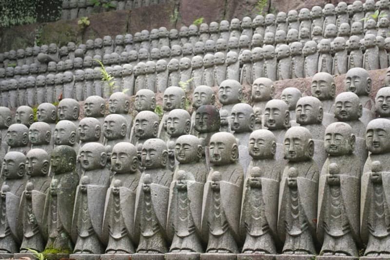 japanese superstitions, statue of fortune gods with big earlobes
