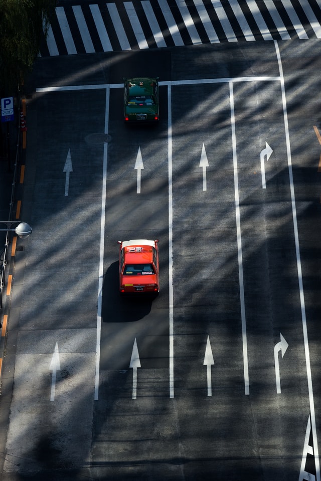 Taxi surrounded by Japanese Road Signs