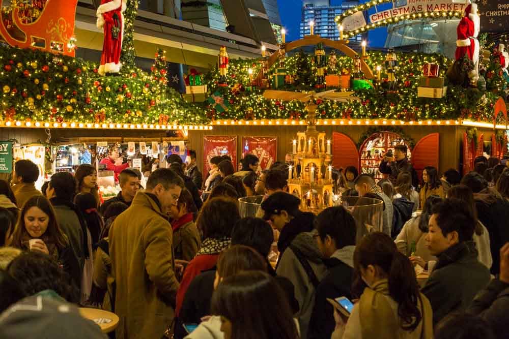 Annual event in Tokyo featuring a bustling crowd at the intricately decorated Roppongi Christmas market