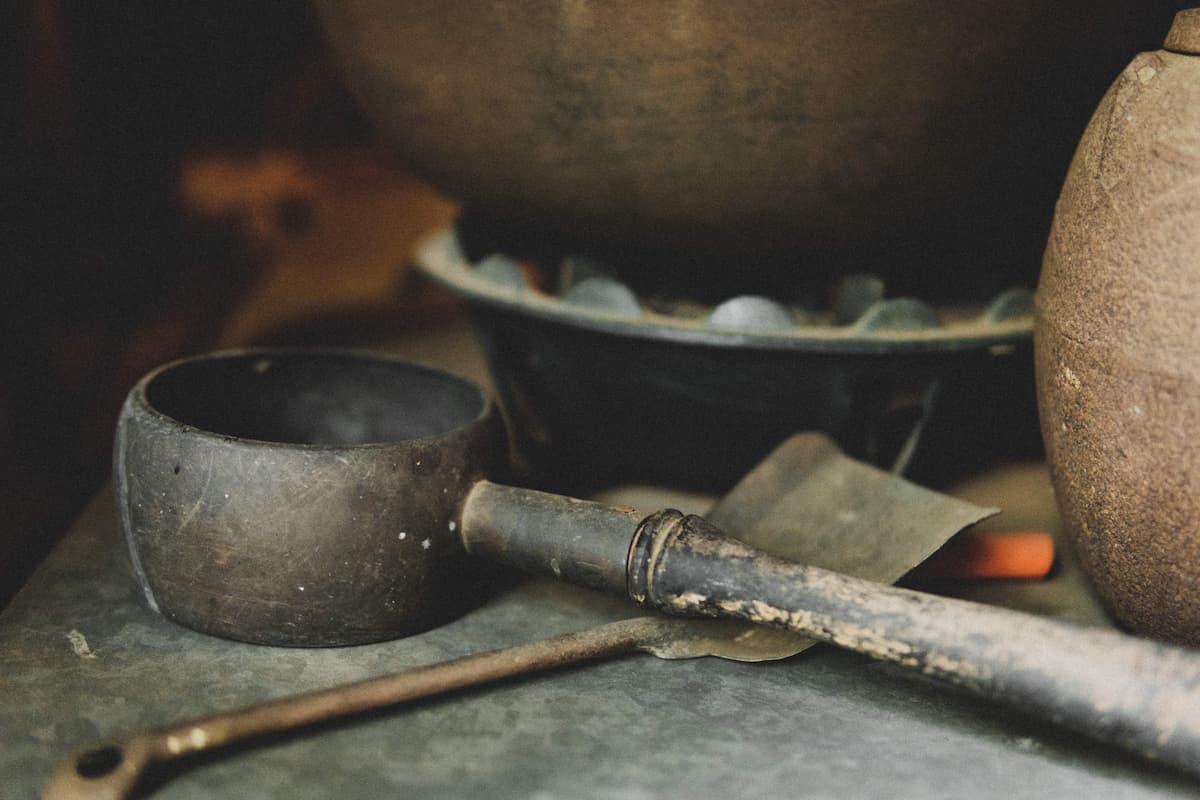 An antique Japanese ladle being sold at an antique market event in Tokyo featuring antique vendors