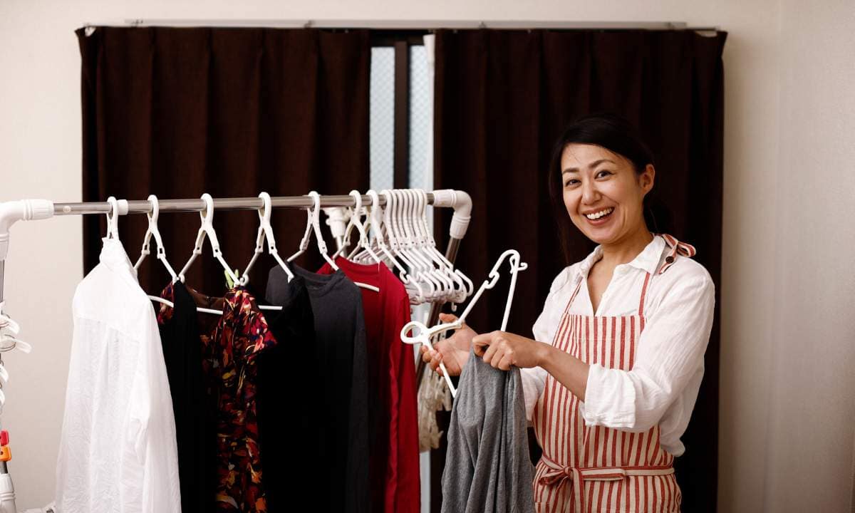 Hanging clothes on a drying rack
