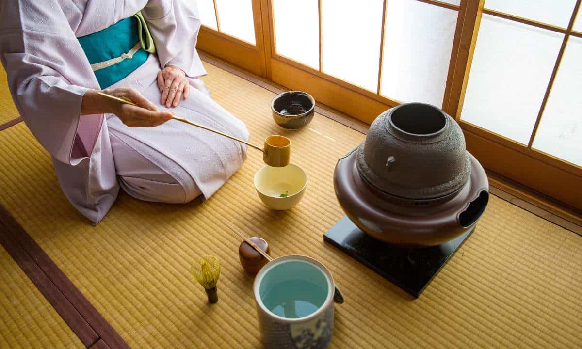 Tea ceremony cup and a lady in a kimono