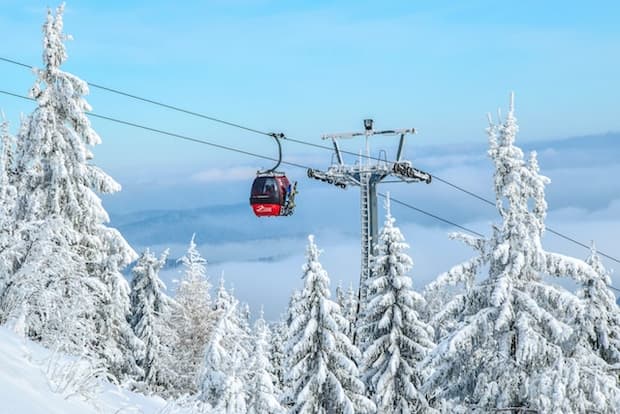 A cable car and ski lift in winter on a Tokyo mountain