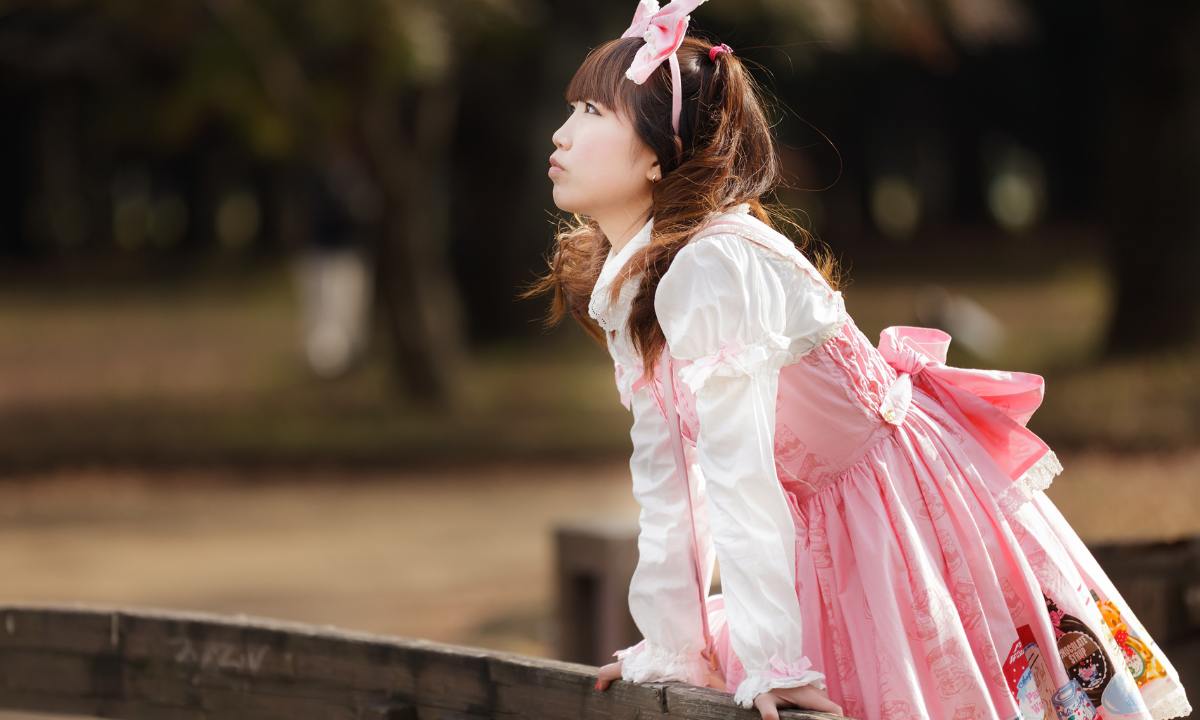 Japanese fashion subculture - girl dressed in cute pink and white lolita outfit