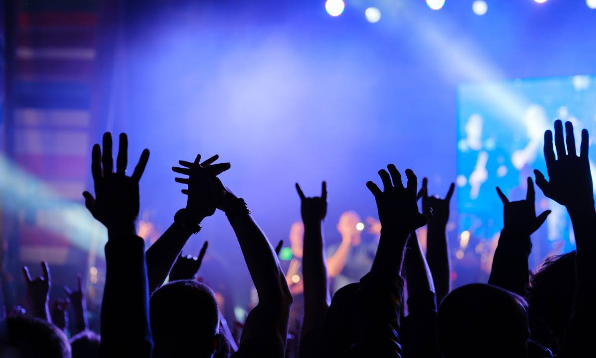 J-rock live performance view of crowd with hands raised