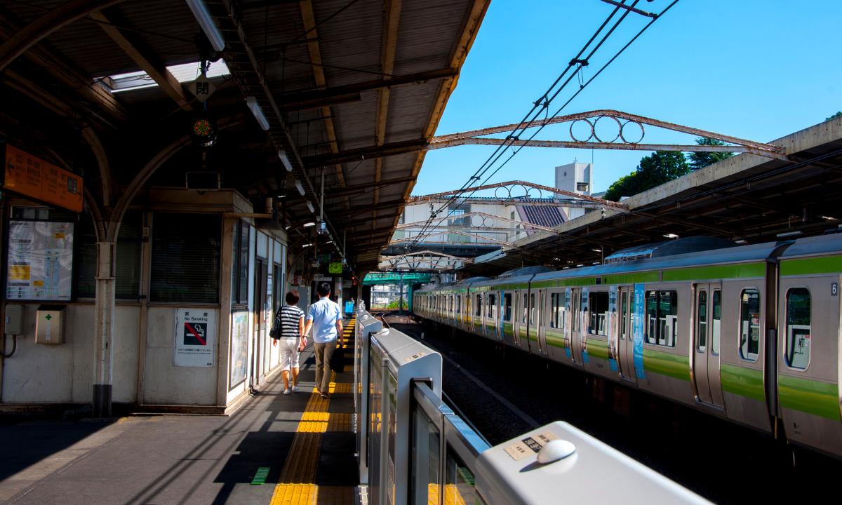 Platform of Tokyo Train station with trains waiting
