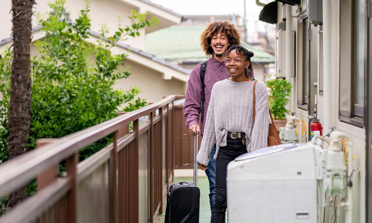 Travelers with suitcases heading for a homestay in Japan
