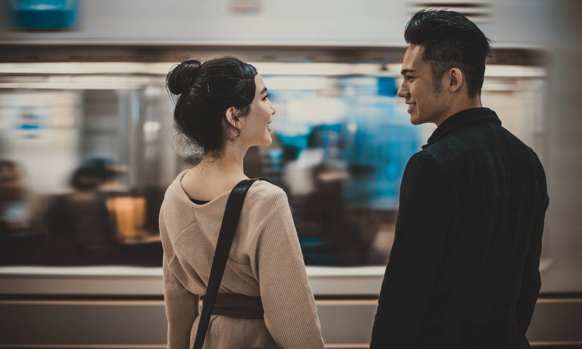 couple looking into each others' eyes at the station - i love you in japanese
