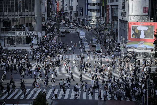 scenery of shibuya crossing filled with pedestrians