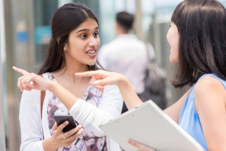 Image of an Woman Asking Another Woman Directions in Japanese
