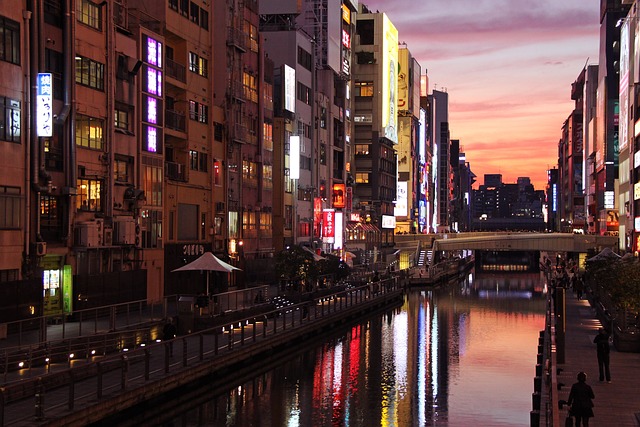 osaka at night - view of dotonbori canal during sunset