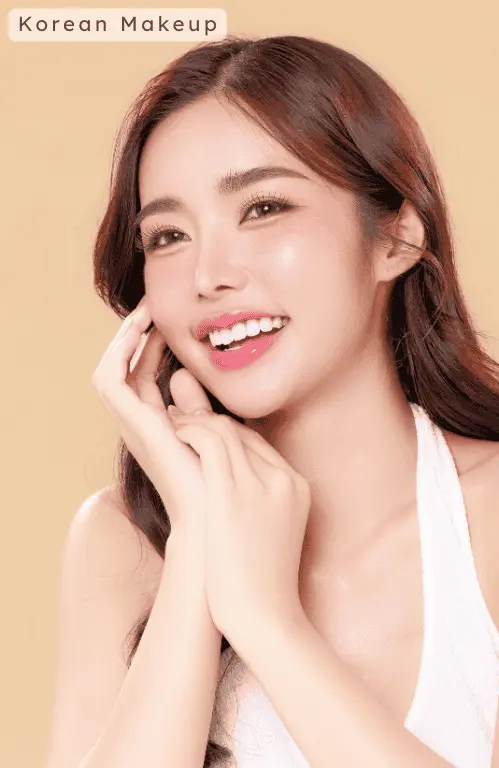 A lady wearing Korean style makeup and white tank top with beige plain background