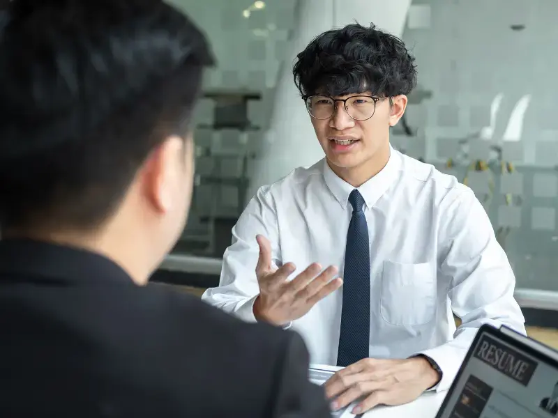 Young international student attending an interview for a part-time job in Japan.