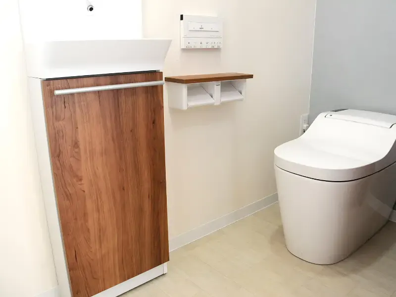 High-tech Japanese toilet with sink and wall-mounted control panel