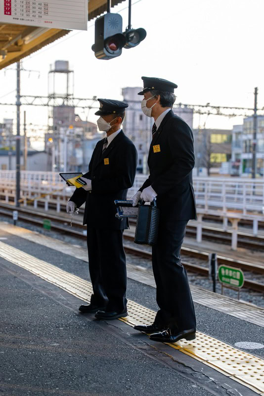 Two Train Station's Staff to Illustrate Who to Ask for Directions in Japanese