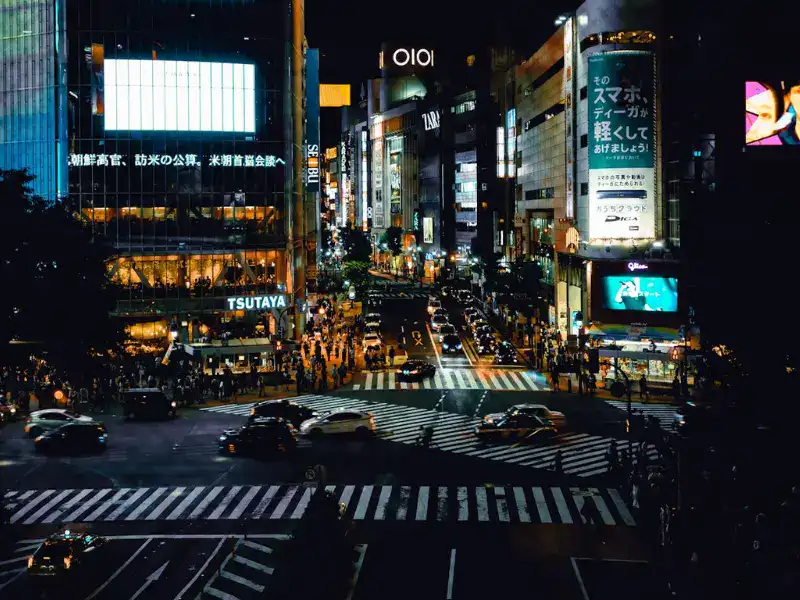Shibuya Crossing, located in Shibuya, Tokyo, at night.