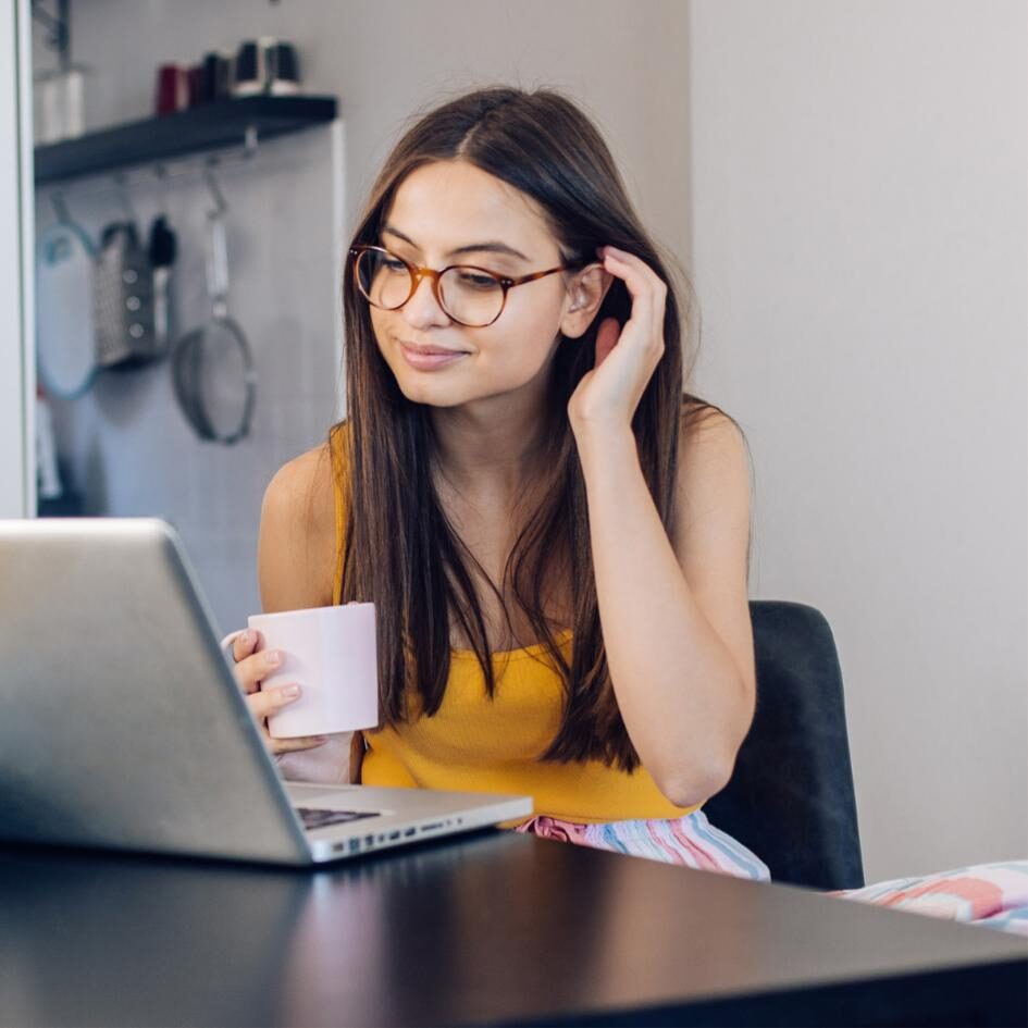 Woman drinking coffee and learning Japanese