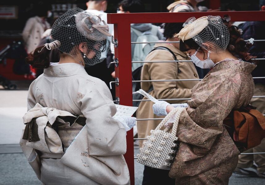 Japanese girls reading omikuji
