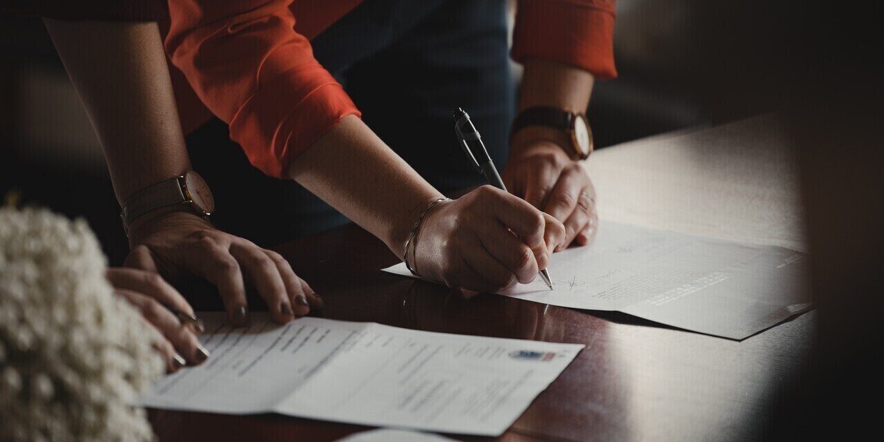 couple signing marriage paperwork in japan